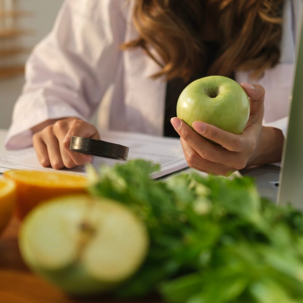 A dietitian reviews a document.